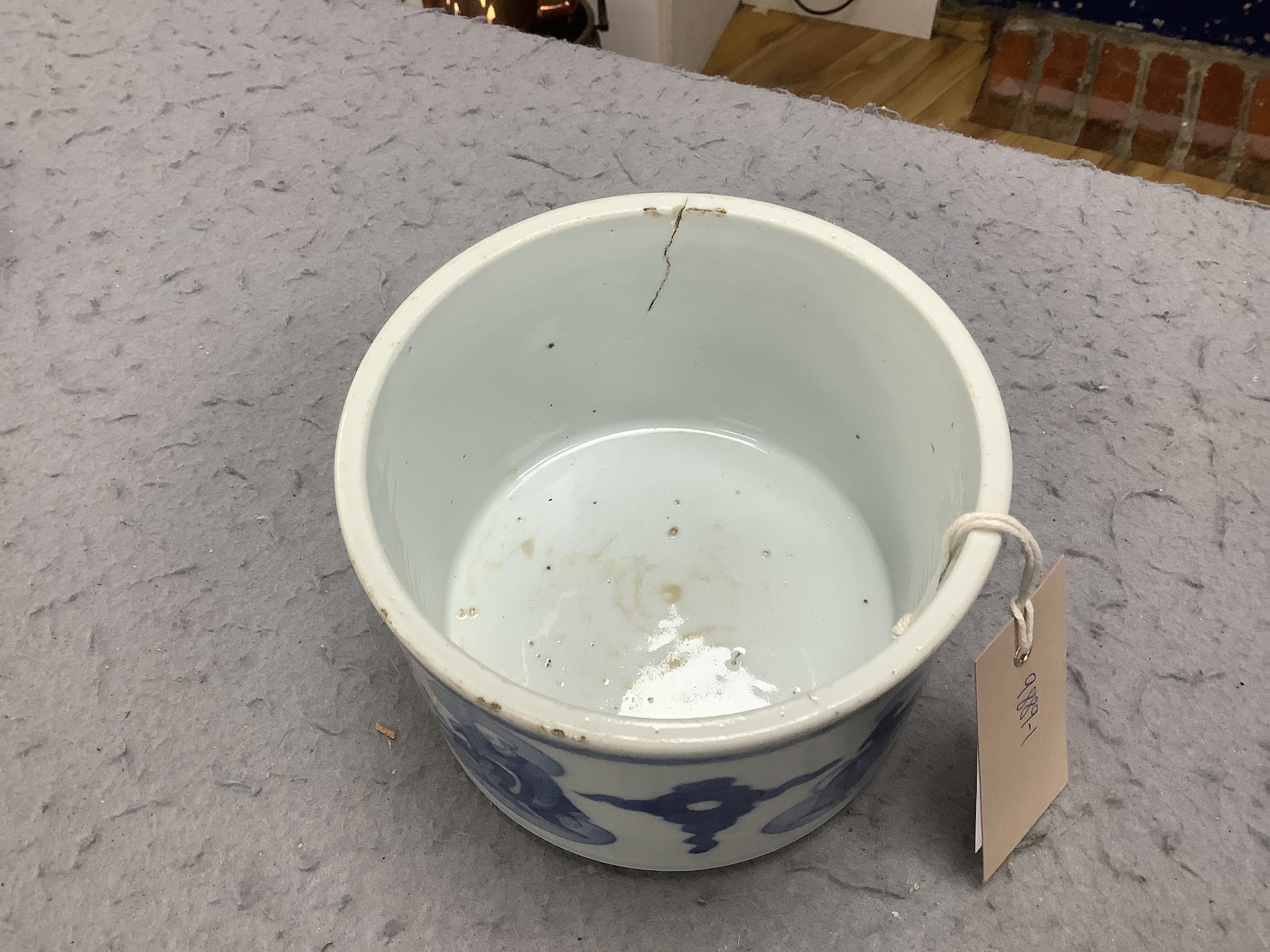 A Chinese blue and white ‘luohan’ brushpot, 13cm diameter